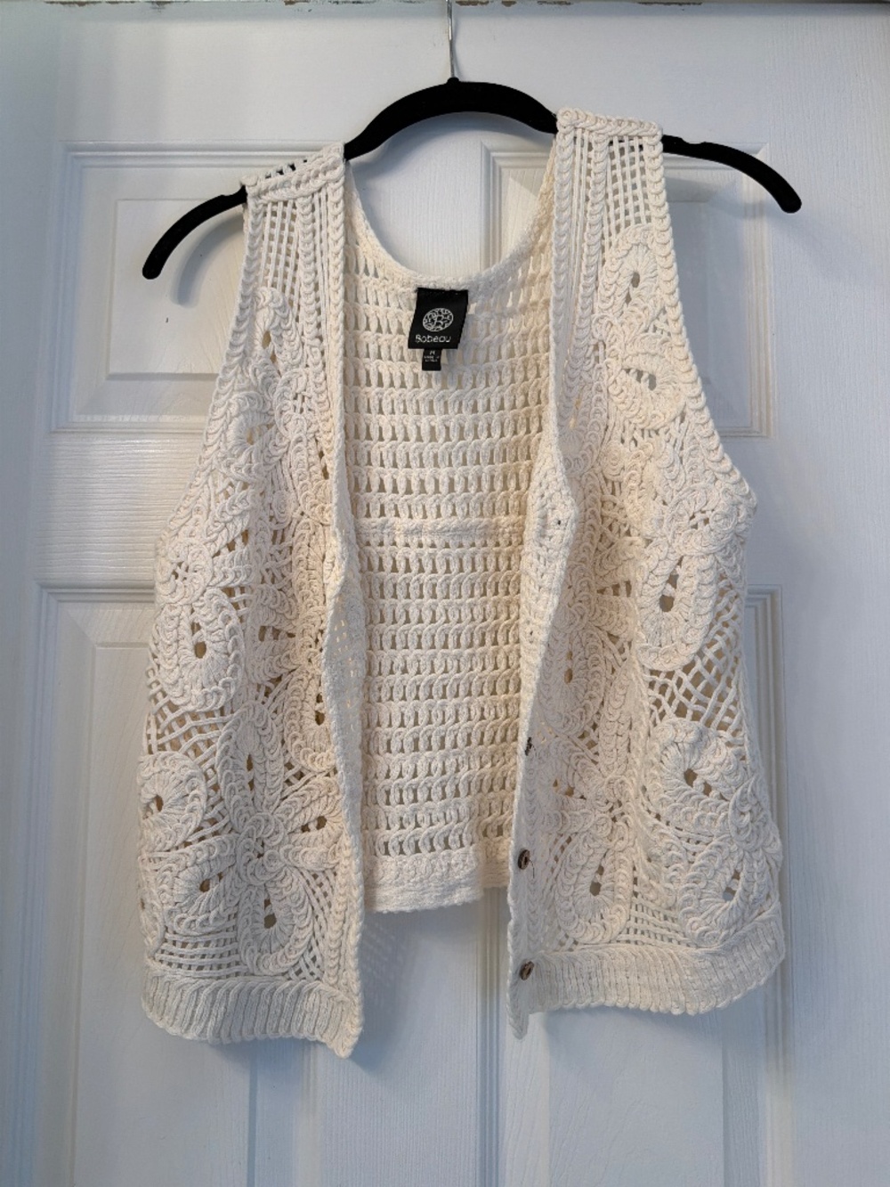 Crochet vest with brown buttons